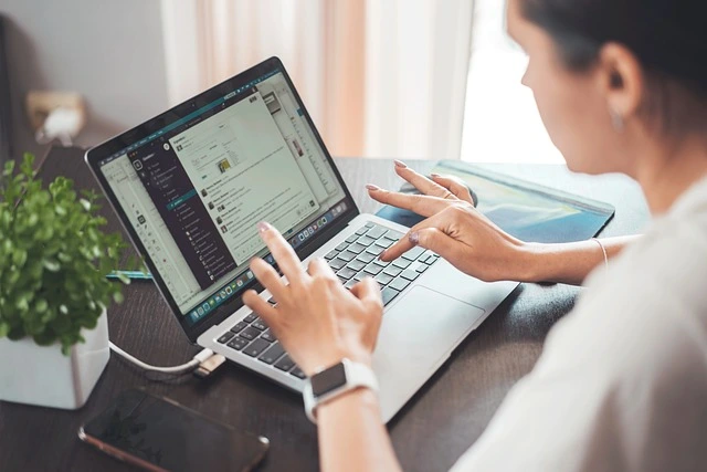 College student working on a online side hustles from home using a laptop in 2025